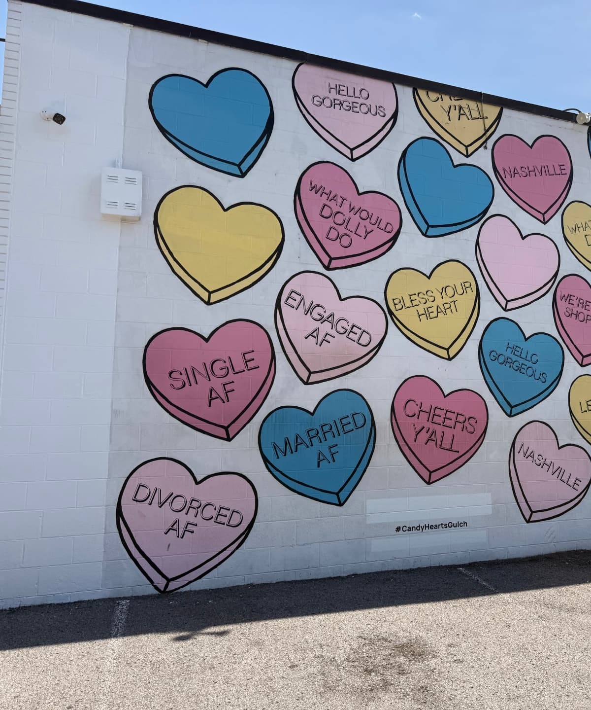 Nashville's Candy Hearts mural on the side of The 615 Hive building, featuring the Engaged AF pastel candy heart